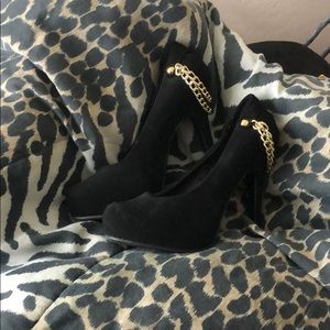 Black and gold stilettos